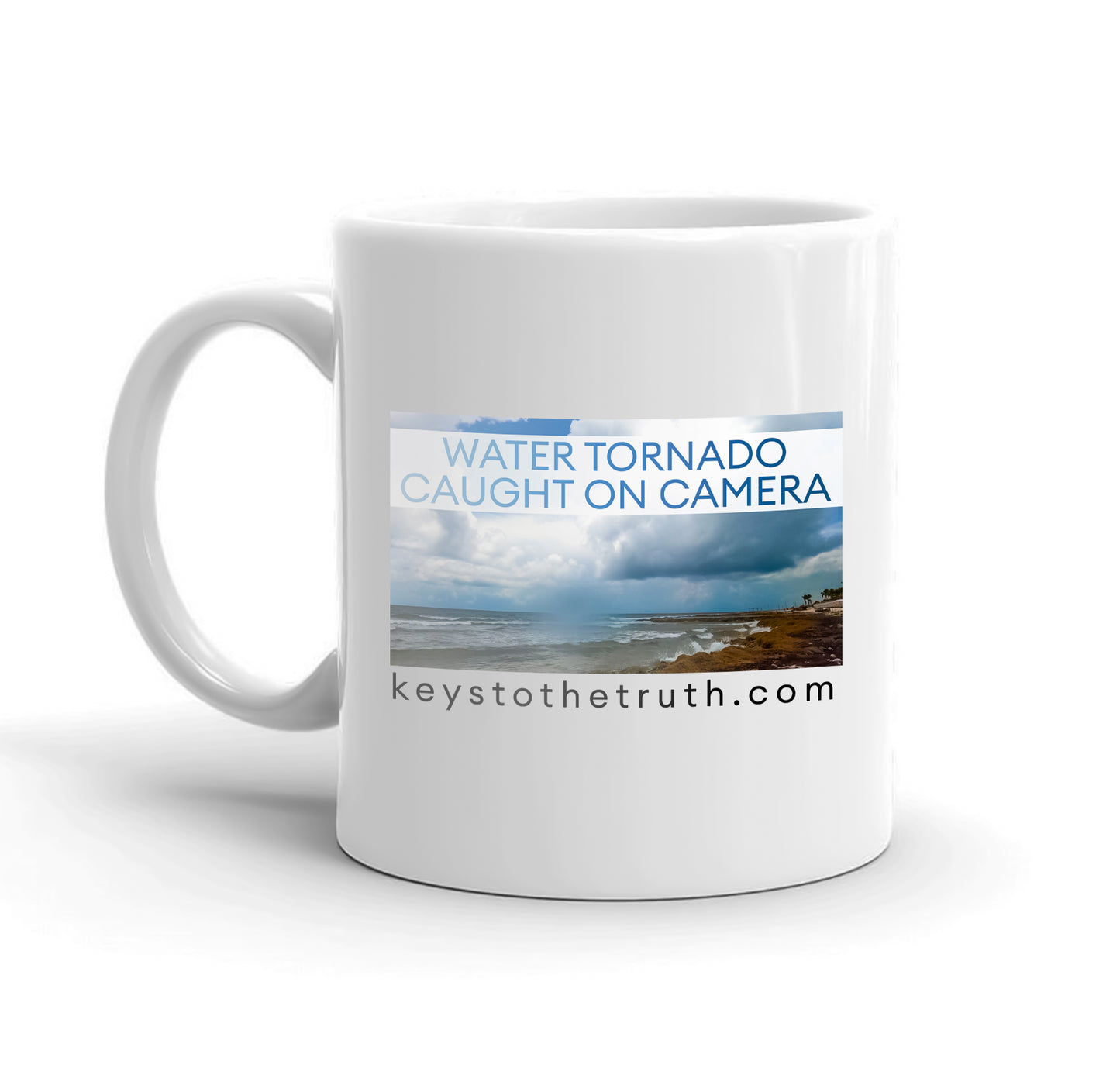 A white mug with the thumbnail print of the youtube video "water tornado caught on camera" and the website "keystothetruth.com".