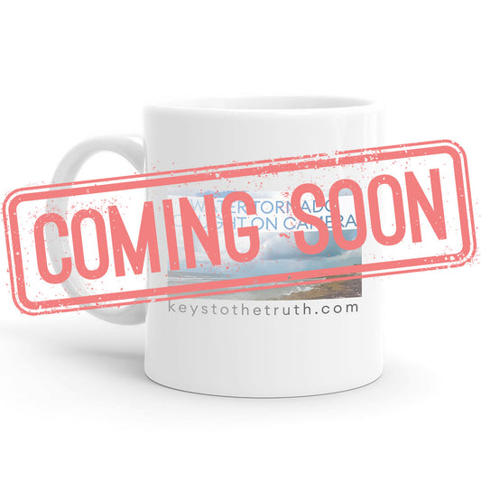 a stamp in red that says "coming soon" and a white Mug with a print on it in the background